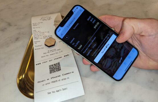 Making an Apple Pay contactless QR payment in a restaurant at the table